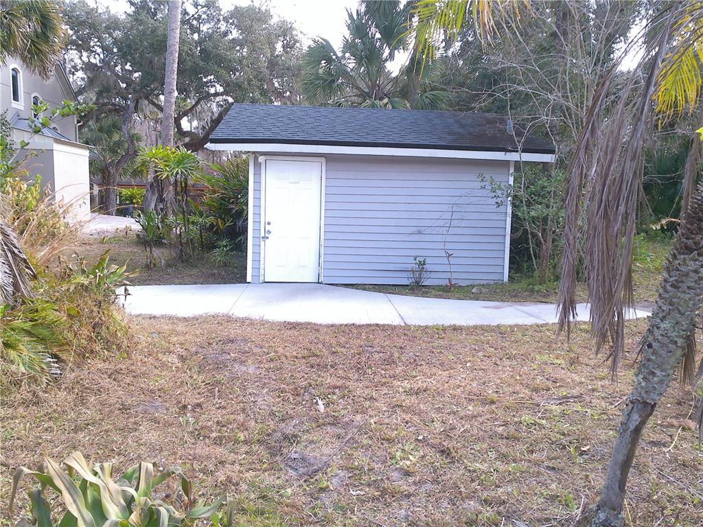 3821 East Osceola Road Geneva, FL 32732 - Photo 3 of 37 a view of a house with a yard and garage