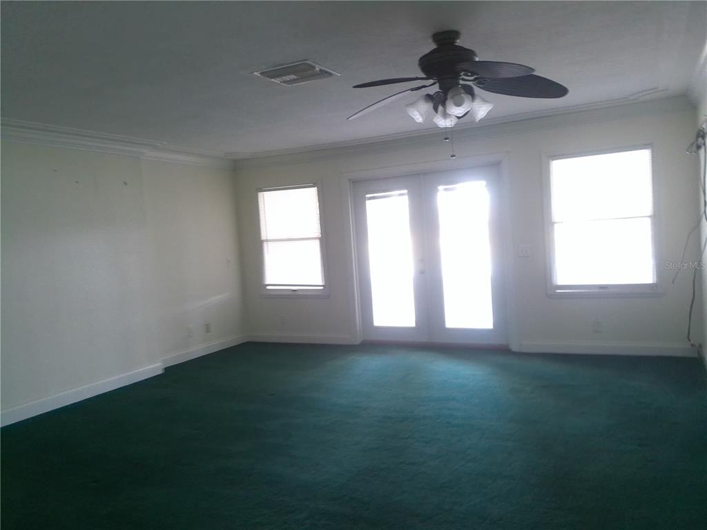 3821 East Osceola Road Geneva, FL 32732 - Photo 32 of 37 a view of an empty room with a window