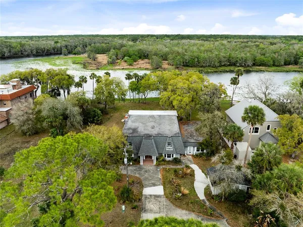 an aerial view of a house with lake view