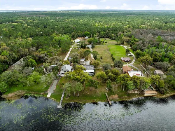 a view of a garden with a building in the background