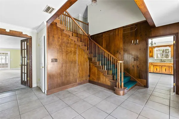 a view of a hallway with staircase