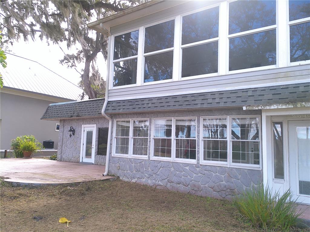 3821 East Osceola Road Geneva, FL 32732 - Photo 9 of 37 a front view of a house with a yard and parking space