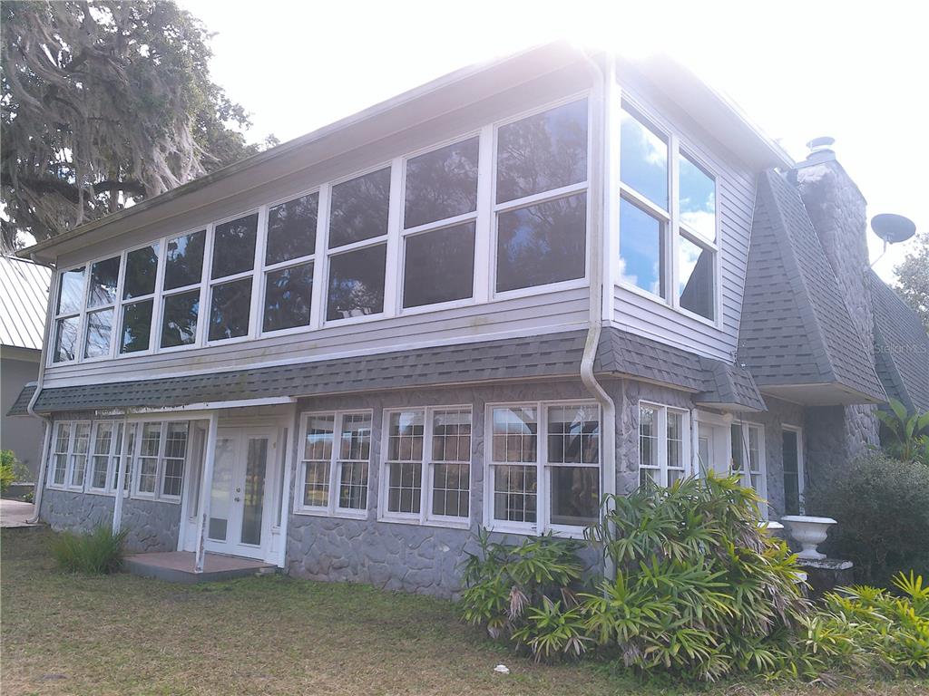 3821 East Osceola Road Geneva, FL 32732 - Photo 10 of 37 a large building with a window and balcony