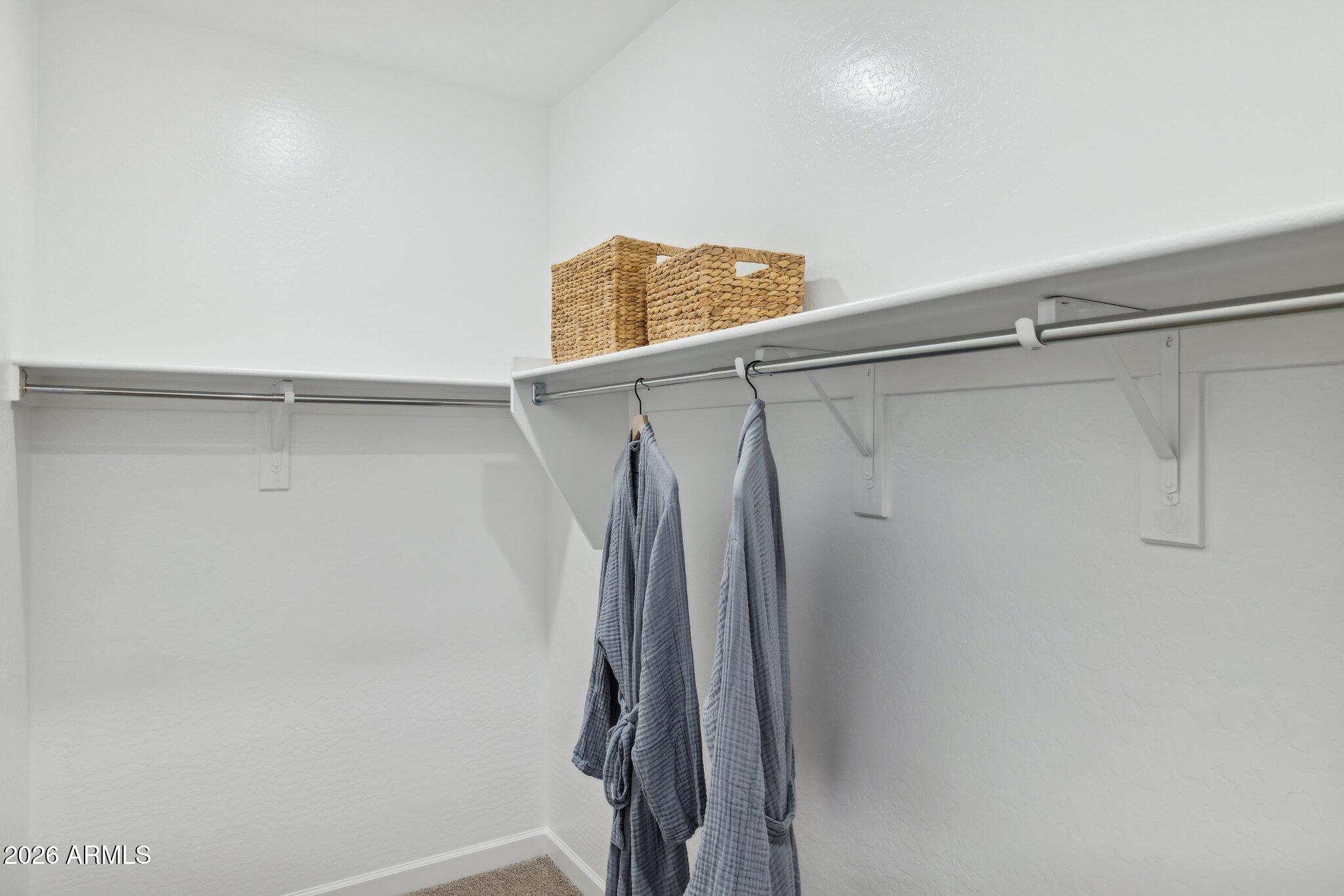 26449 West Crown King Road Buckeye, AZ 85326 - Photo 21 of 33 a bathroom with a shower and a glass door