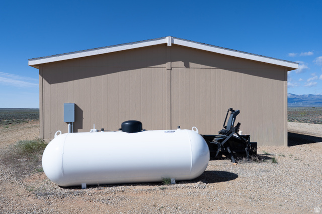 700 East Peter Springs Road Monticello, UT 84535 - Photo 7 of 57 Property exterior featuring neutral vertical siding and a white propane tank