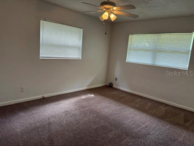 2075 Howell Branch Road, Unit 101 Maitland, FL 32751 - Photo 7 of 9 a view of an empty room with a window