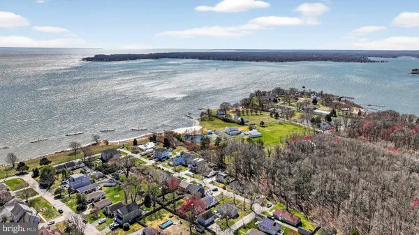 a view of a lake with houses in the back