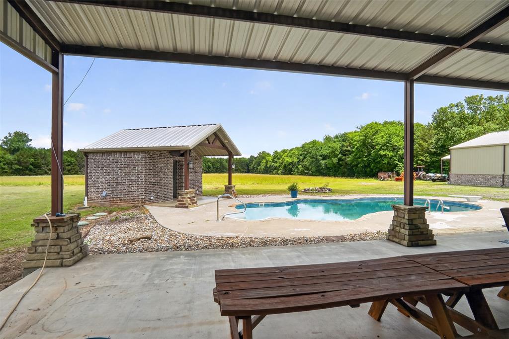 1524 County Road Sumner, TX 75486 - Photo 29 of 35 20x23 back Covered patio with concrete flooring