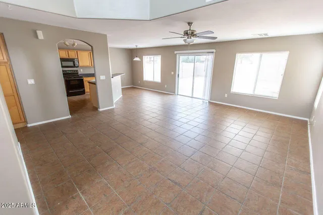 a view of a big room with windows and cabinet