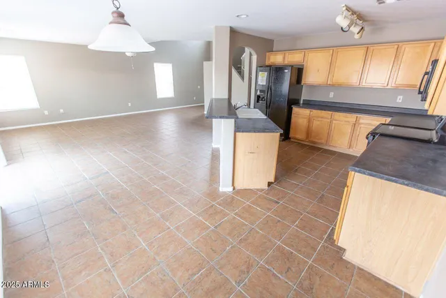 a view of a kitchen with furniture and a window