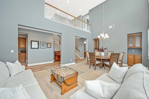 a view of a dining room with furniture and window