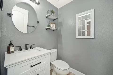 a spacious bathroom with a bathtub and a sink