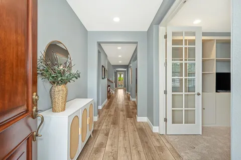 a view of livingroom with hardwood floor and windows