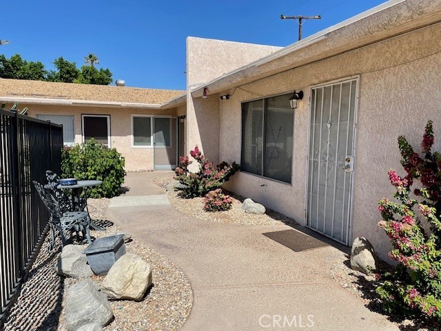 73740 Santa Rosa Way, Unit 5 Palm Desert, CA 92260 - Photo 6 of 20 a view of a house with patio