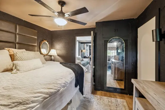 a bedroom with bed and window