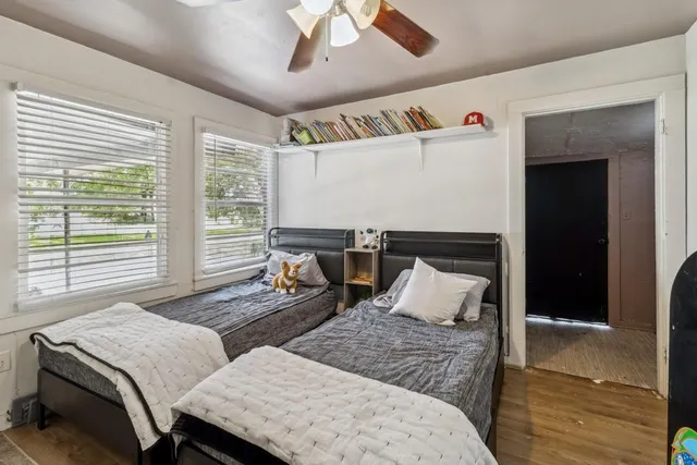 a bedroom with a bed and a television