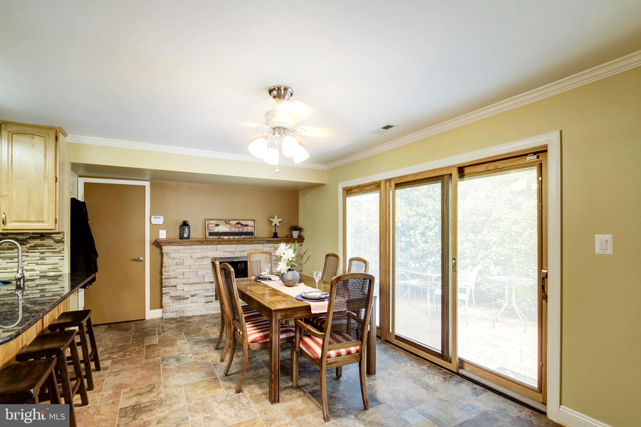 15707 Bond Mill Road Laurel, MD 20707 - Photo 12 of 48 Dining room w/FP Pella windows opens to side patio