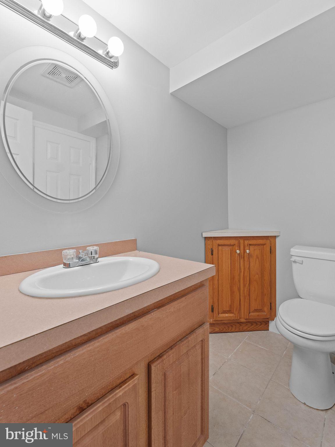 8 Chesterfield Road Sewell, NJ 08080 - Photo 43 of 57 a bathroom with a sink a toilet and a mirror
