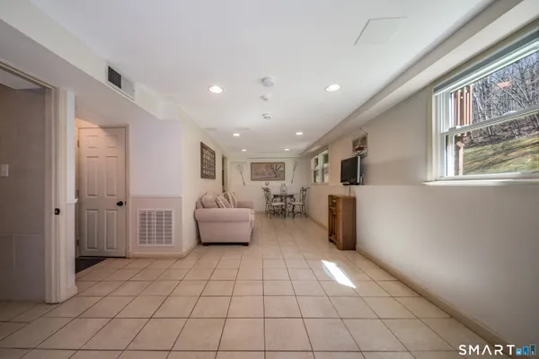 a living room with furniture and a rug