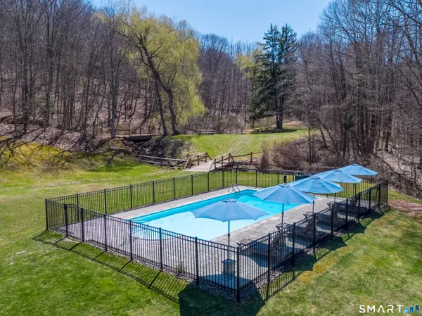 a view of a wooden deck with a yard