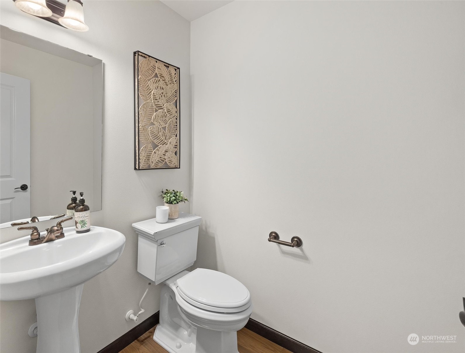 2205 239th Place Southwest Bothell, WA 98021 - Photo 24 of 40 a bathroom with a sink mirror and toilet