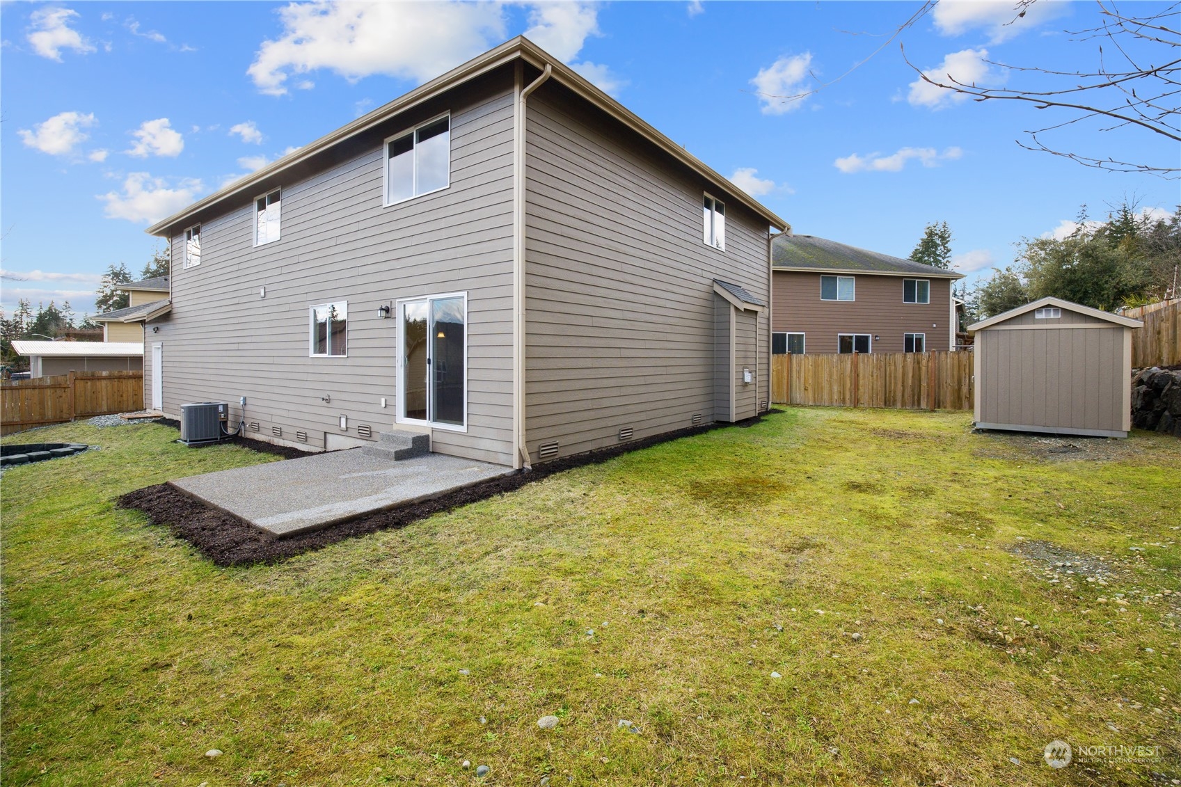 2205 239th Place Southwest Bothell, WA 98021 - Photo 28 of 40 a backyard of a house with table and chairs