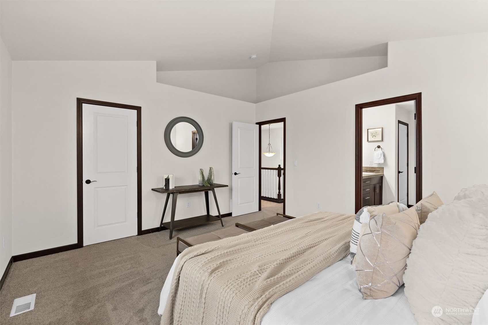 2205 239th Place Southwest Bothell, WA 98021 - Photo 3 of 40 a bedroom with a bed and a chandelier