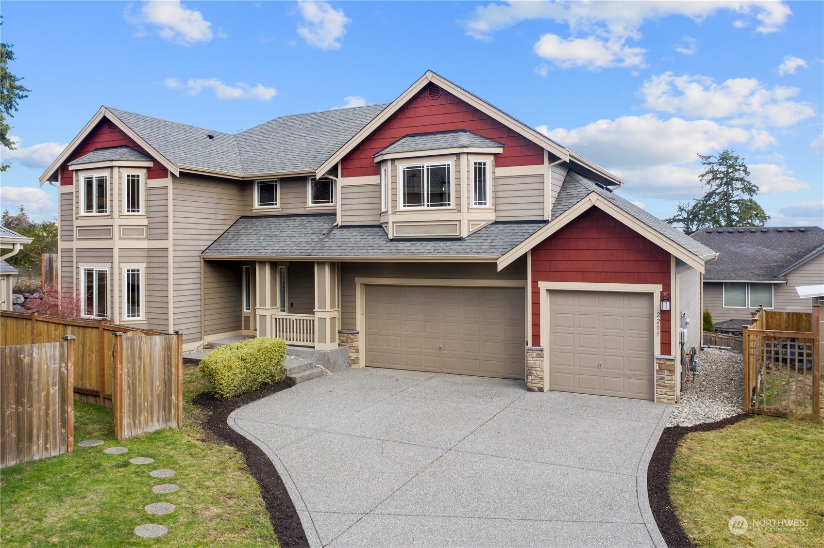2205 239th Place Southwest Bothell, WA 98021 - Photo 39 of 40 a front view of a house with a yard and garage