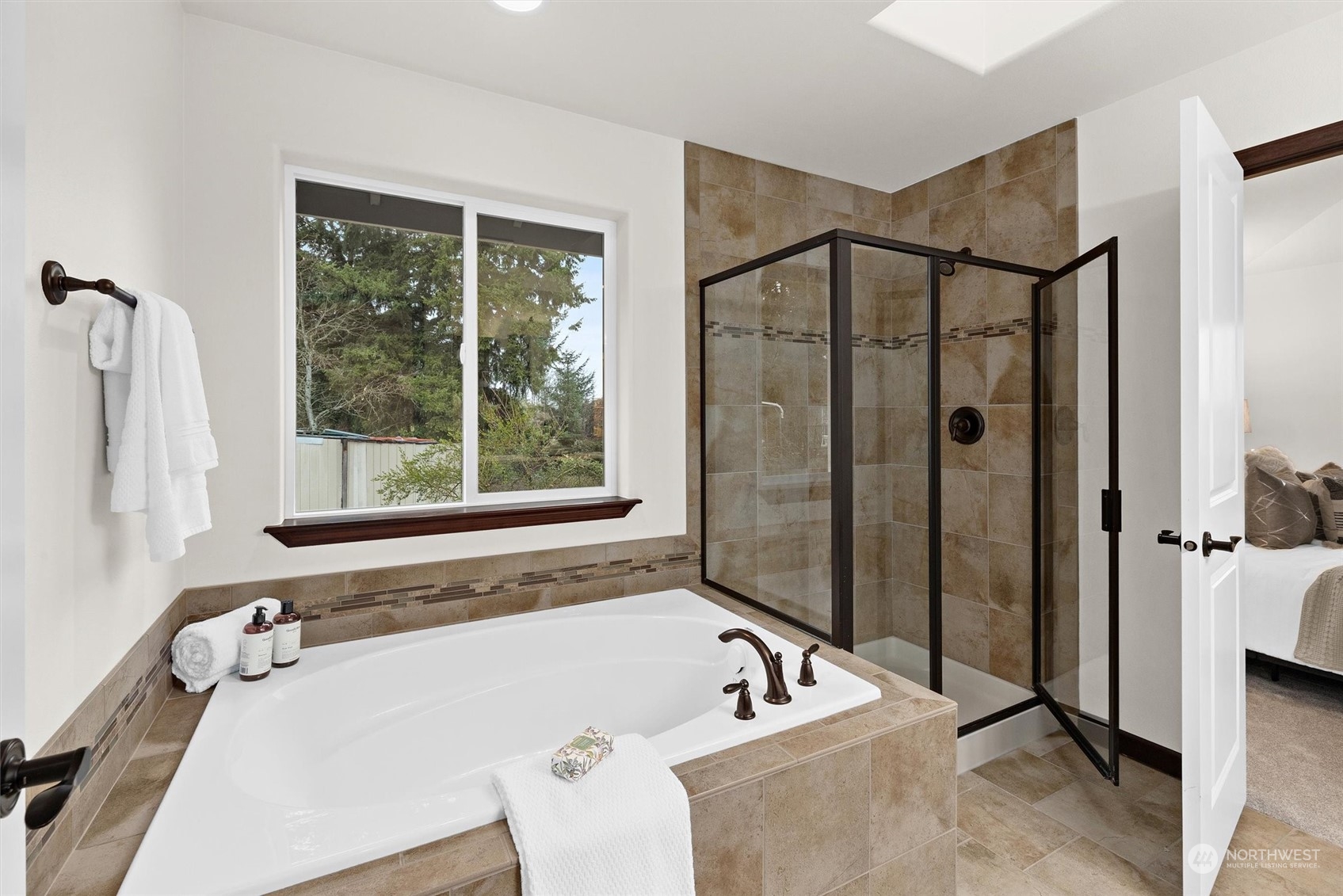 2205 239th Place Southwest Bothell, WA 98021 - Photo 5 of 40 a bathroom with a tub and a shower