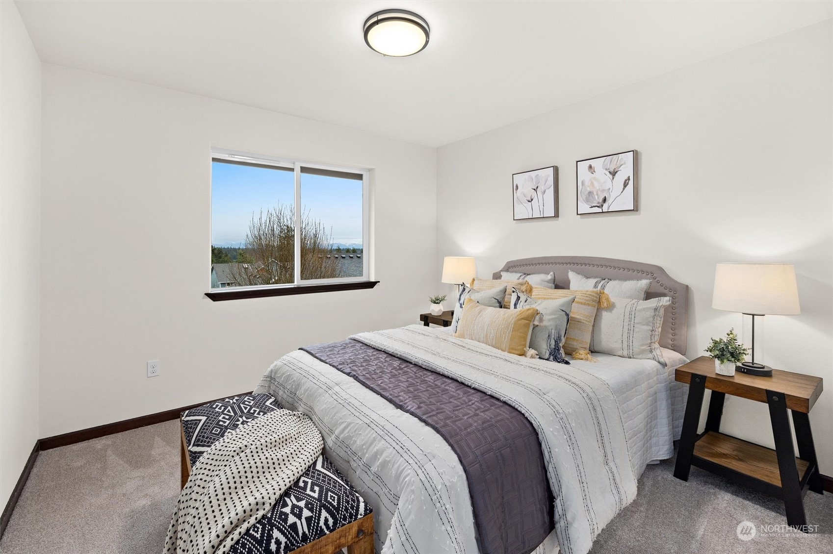 2205 239th Place Southwest Bothell, WA 98021 - Photo 7 of 40 a bedroom with a bed and painting on the wall
