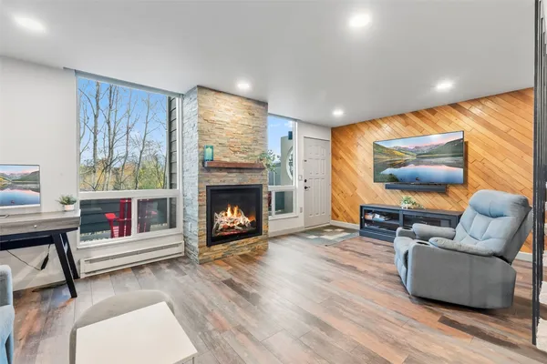 a living room with furniture and a fireplace