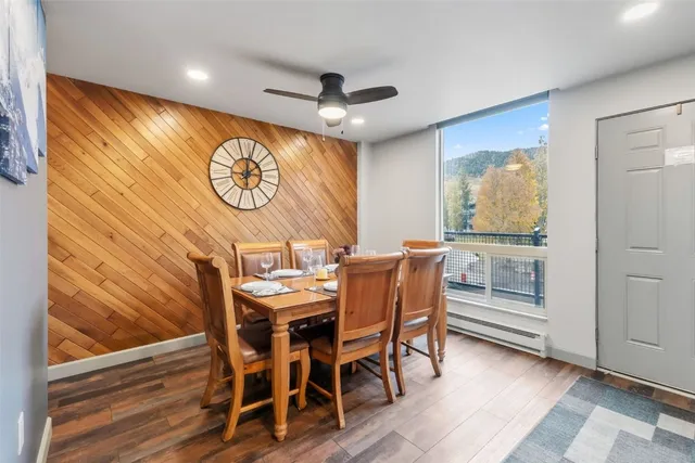 a view of a dining room with furniture window and wooden floor