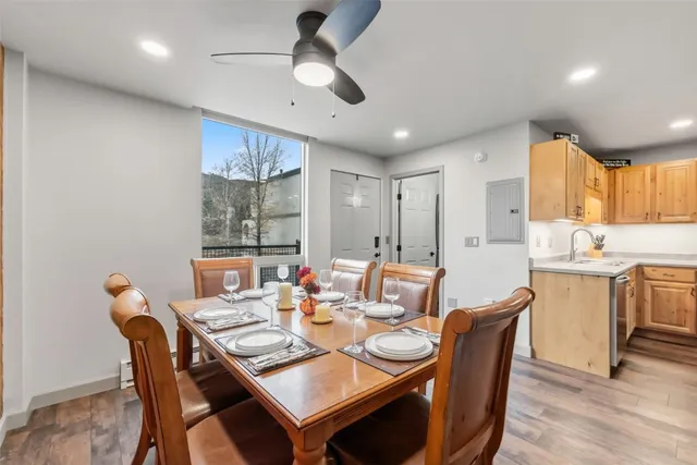 a view of a dining room with furniture window and wooden floor