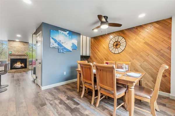 a view of a room with furniture and wooden floor