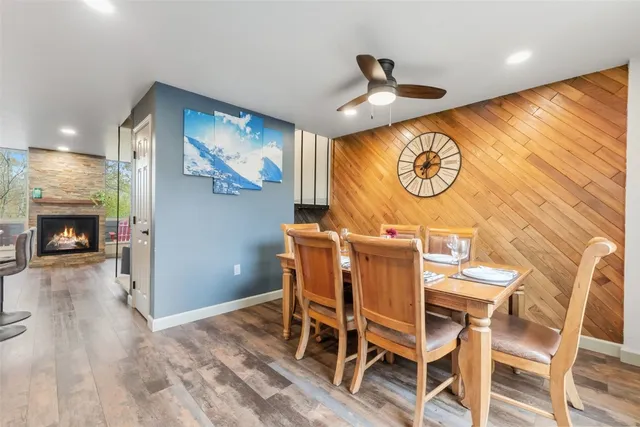 a view of a room with furniture and wooden floor