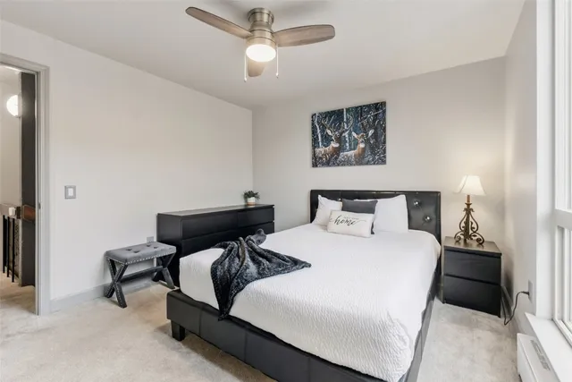 a bedroom with bed and window