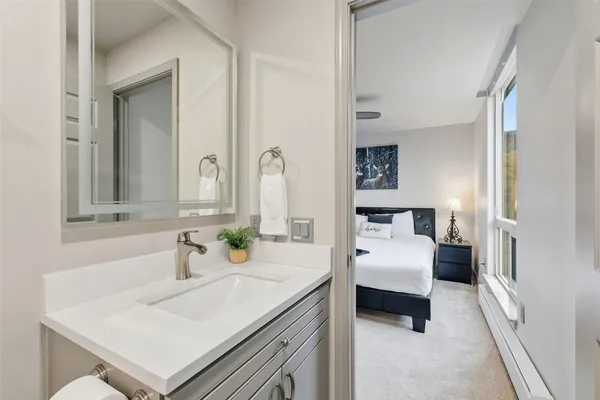 a bed room with a bed and a window