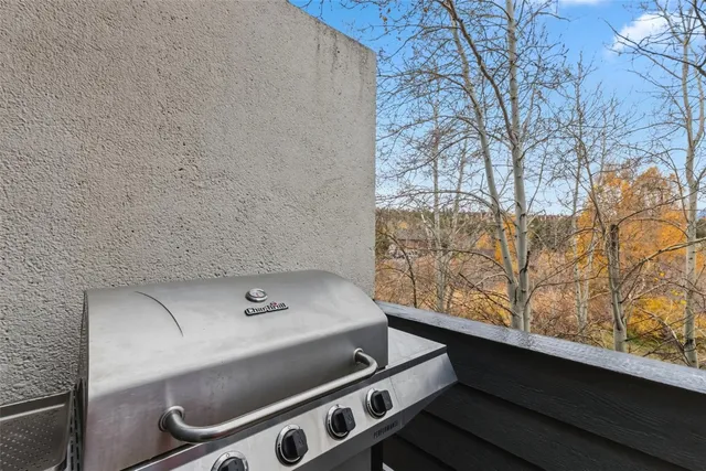 a balcony with table and chairs