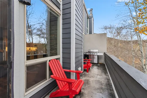 a view of a backyard with sitting area