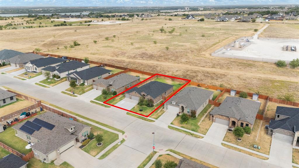 1812 Millbrae Road Cleburne, TX 76033 - Photo 28 of 30 Single-story residence with a two-car garage, concrete driveway, and a fenced yard