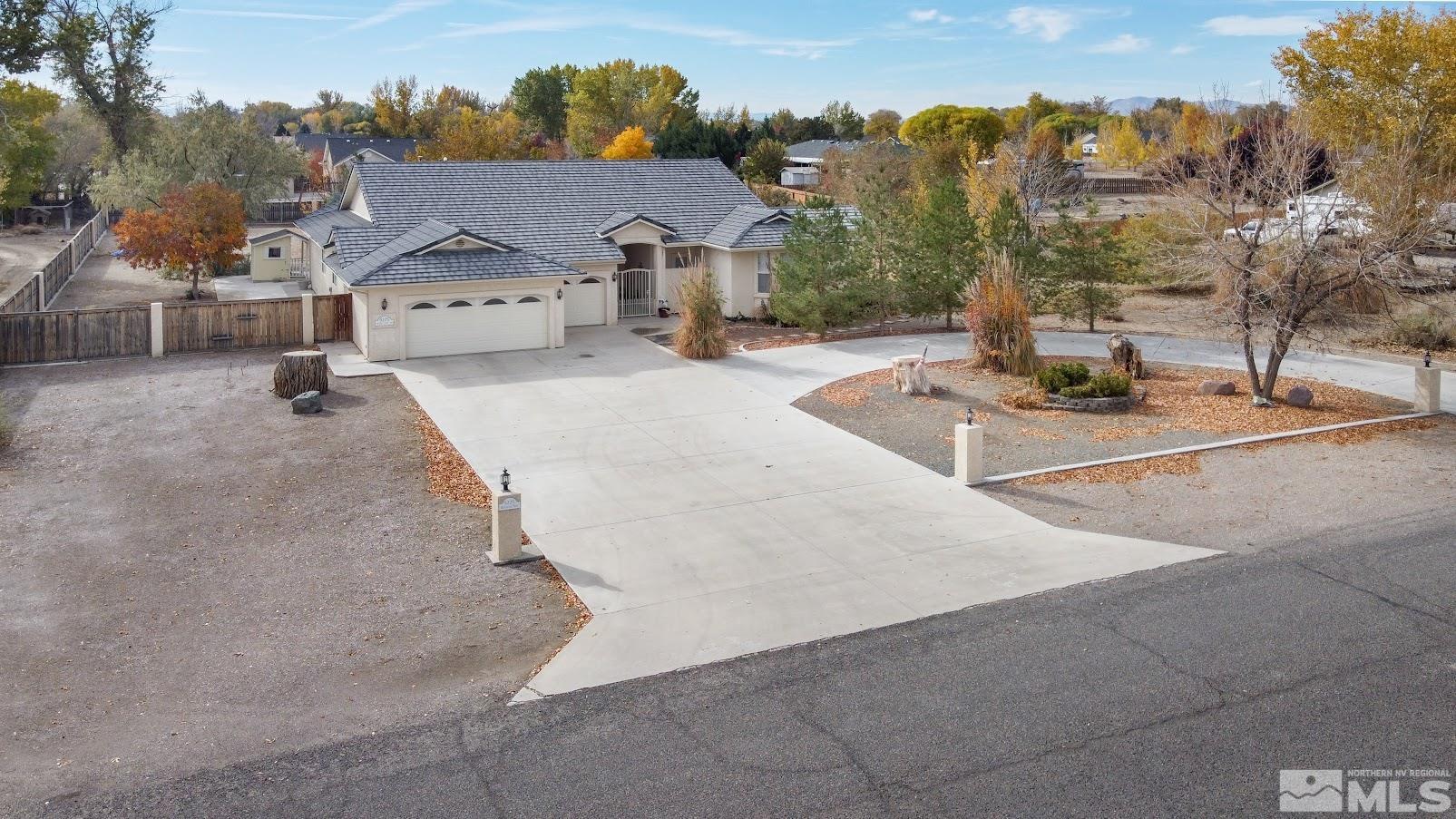 5275 Rivers Edge Drive Fallon, NV 89406 - Photo 1 of 36 a view of a street with houses