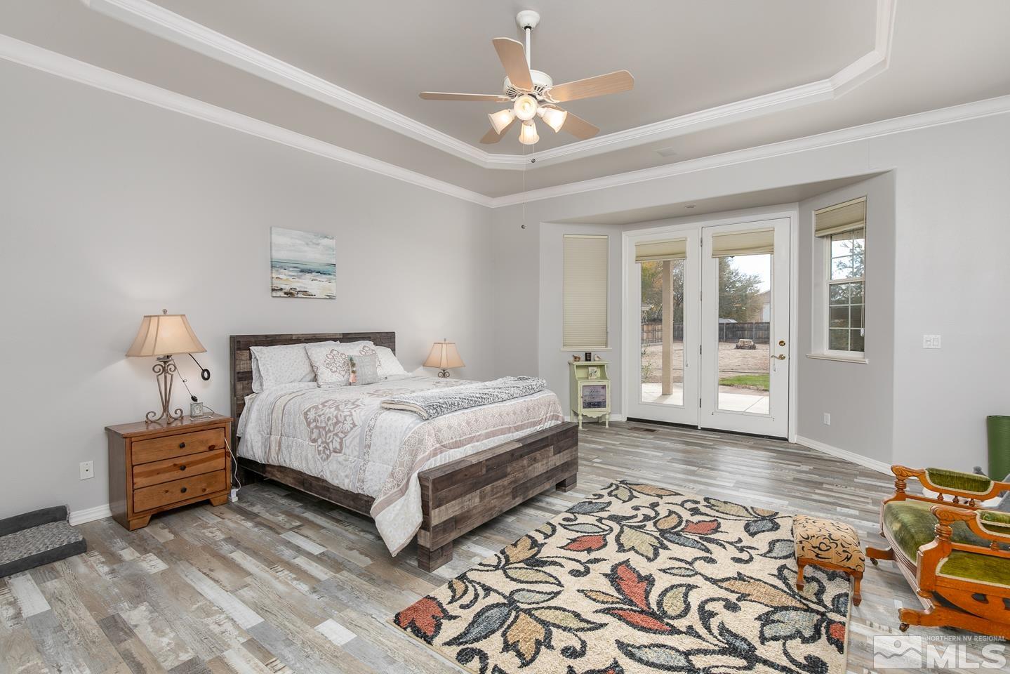 5275 Rivers Edge Drive Fallon, NV 89406 - Photo 19 of 36 a spacious bedroom with a bed and a window