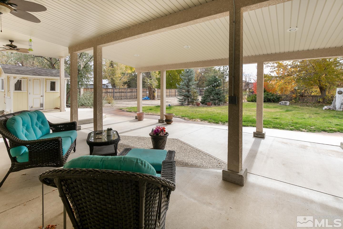 5275 Rivers Edge Drive Fallon, NV 89406 - Photo 34 of 36 a living room filled with furniture and garden view