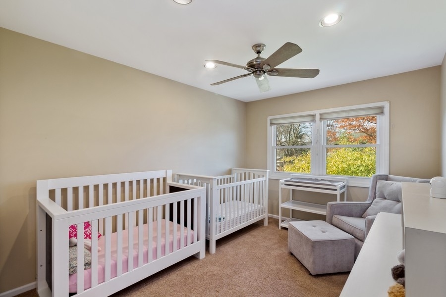 1164 Devonshire Road Buffalo Grove, IL 60089 - Photo 14 of 20 a bedroom with furniture and a window