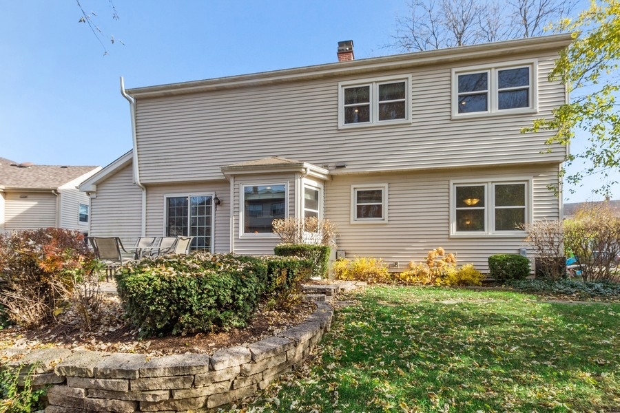 1164 Devonshire Road Buffalo Grove, IL 60089 - Photo 20 of 20 a front view of a house with a yard