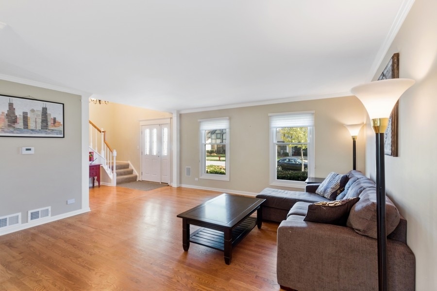 1164 Devonshire Road Buffalo Grove, IL 60089 - Photo 4 of 20 a living room with furniture and a wooden floor