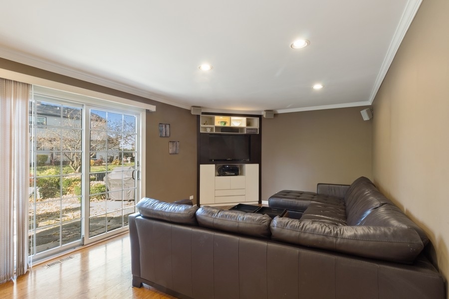 1164 Devonshire Road Buffalo Grove, IL 60089 - Photo 8 of 20 a living room with furniture and a large window