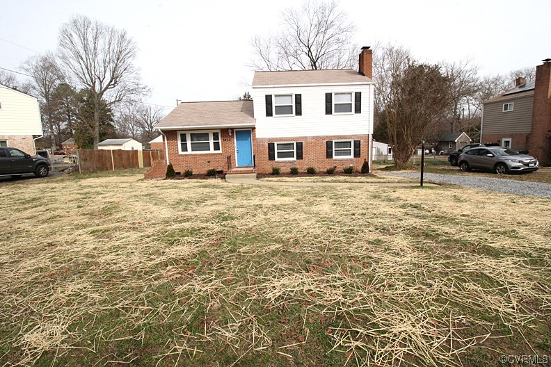 6440 Commander Road Richmond, VA 23224 - Photo 1 of 20 a front view of a house with a yard