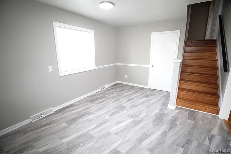 6440 Commander Road Richmond, VA 23224 - Photo 11 of 20 wooden floor in an empty room with a window
