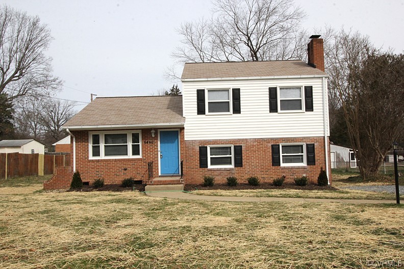 6440 Commander Road Richmond, VA 23224 - Photo 2 of 20 a view of a house with a yard